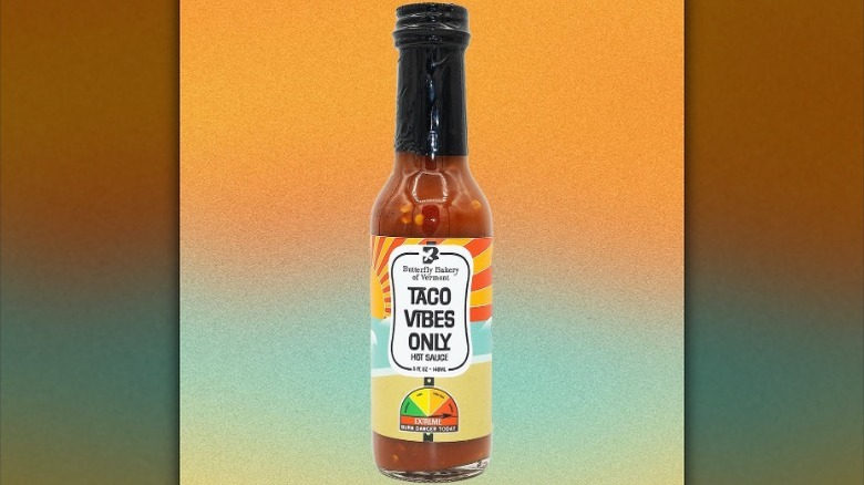 A bottle of Butterfly Bakery of Vermont Taco Vibes Only Hot Sauce.
