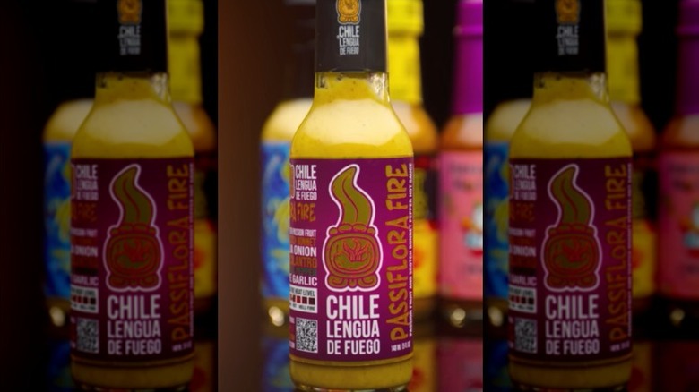 A bottle of Chile Lengua De Fuego Passiflora Fire Hot Sauce.