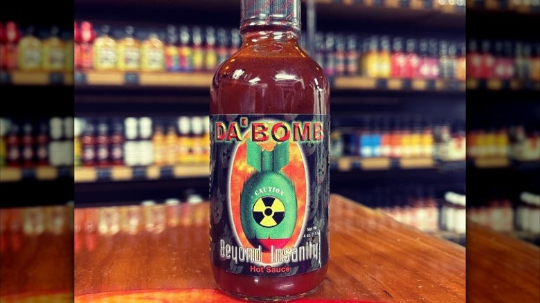 A bottle of Da' Bomb Beyond Insanity Hot Sauce.