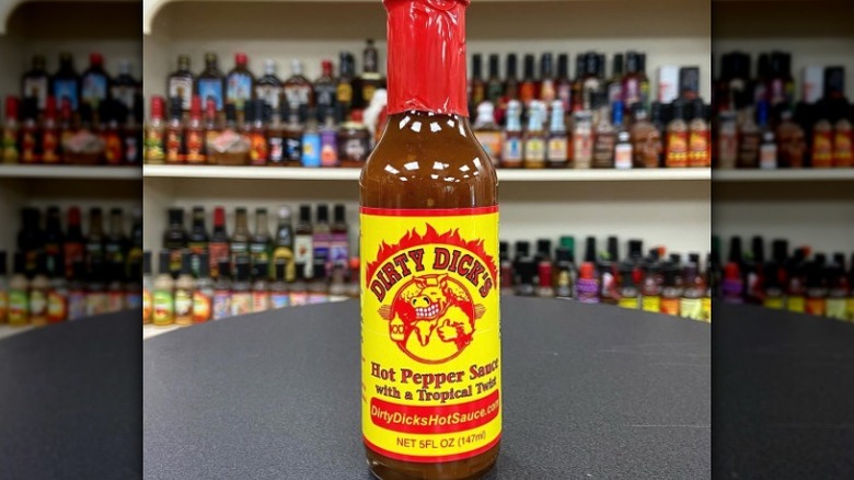 A bottle of Dirty Dick's Hot Pepper Sauce With A Tropical Twist.