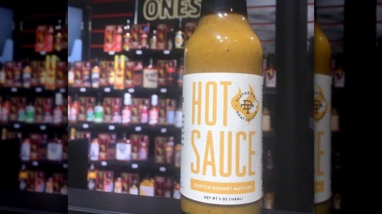 A bottle of Double Take Scotch Bonney Mustard Hot Sauce.