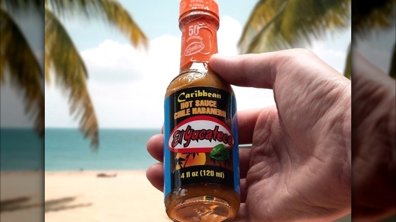 A bottle of El Yucateco Caribbean hot sauce.