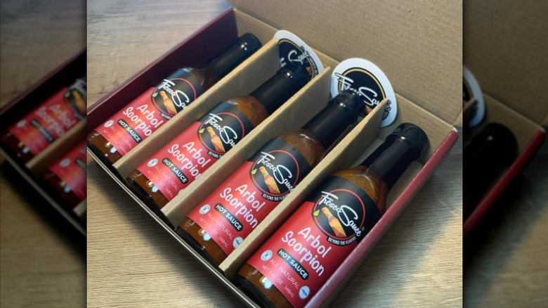Bottles of Fresco Sauce Arbol Scorpion Hot Sauce.