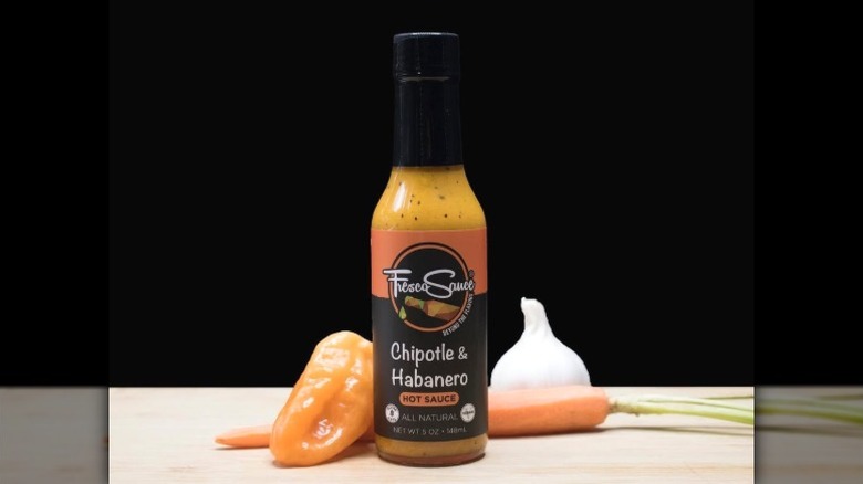 A bottle of Fresco Sauce Company Chipotle & Habanero Hot Sauce.