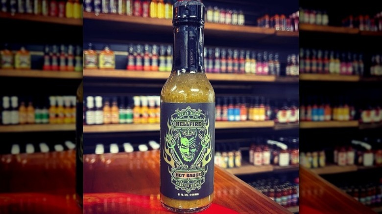 A bottle of Hellfire Devil's Blend Hot Sauce.