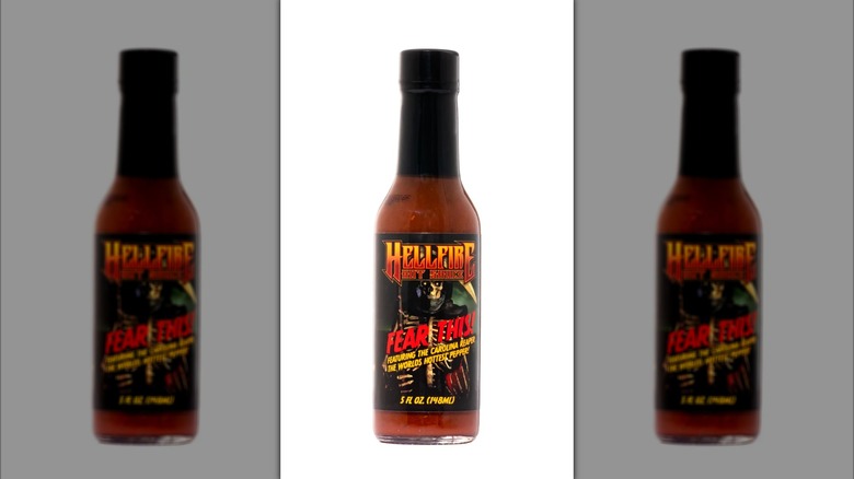 A bottle of Hellfire Fear This! Hot Sauce.