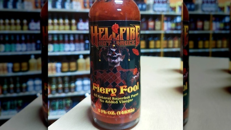 A bottle of Hellfire Fiery Fool Hot Sauce.