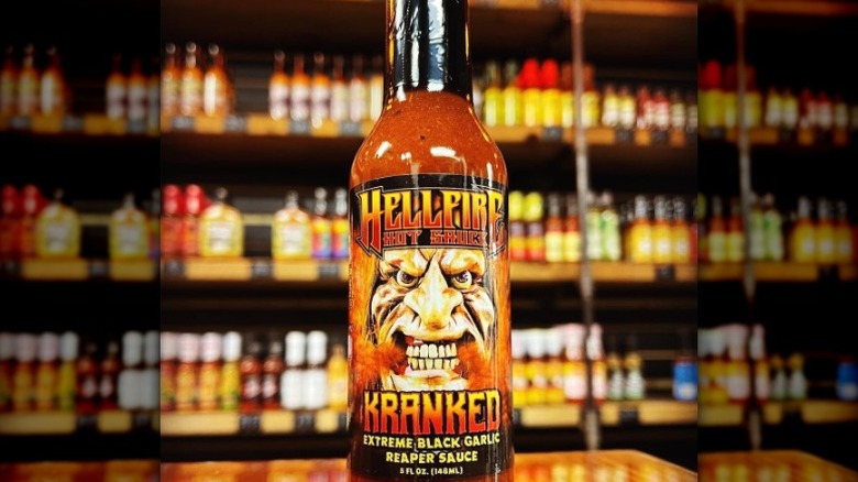 A bottle of Hellfire Kranked Hot Sauce.