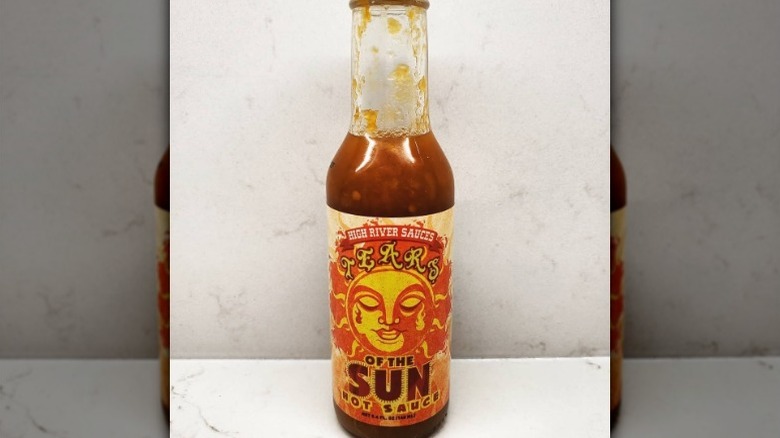 A bottle of High River Sauces Tears of the Sun Hot Sauce.