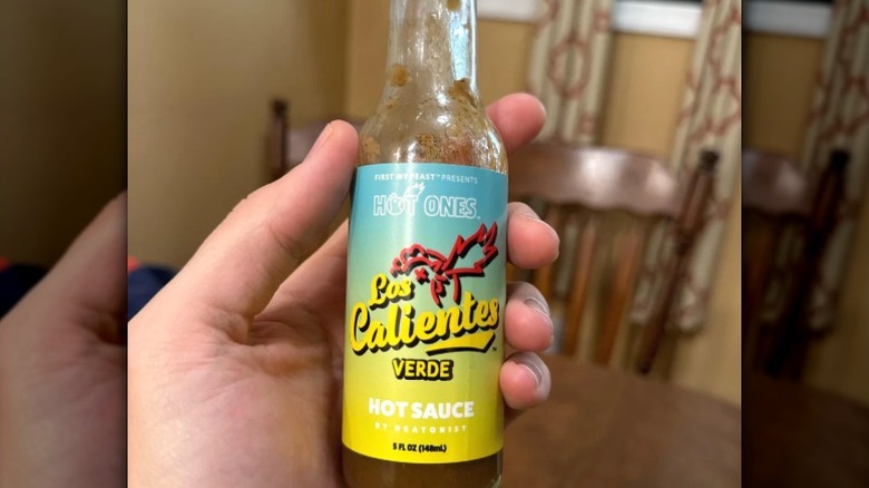 A bottle of Hot Ones Los Calientes Verde hot sauce.