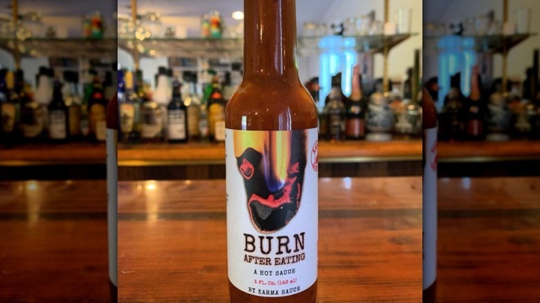 A bottle of Karma Sauce Burn After Eating Hot Sauce.