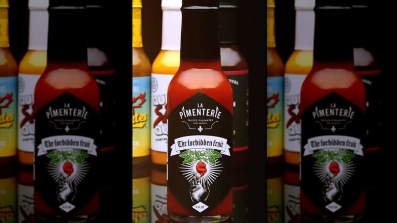 A bottle of La Pimenterie The Forbidden Fruit Hot Sauce.
