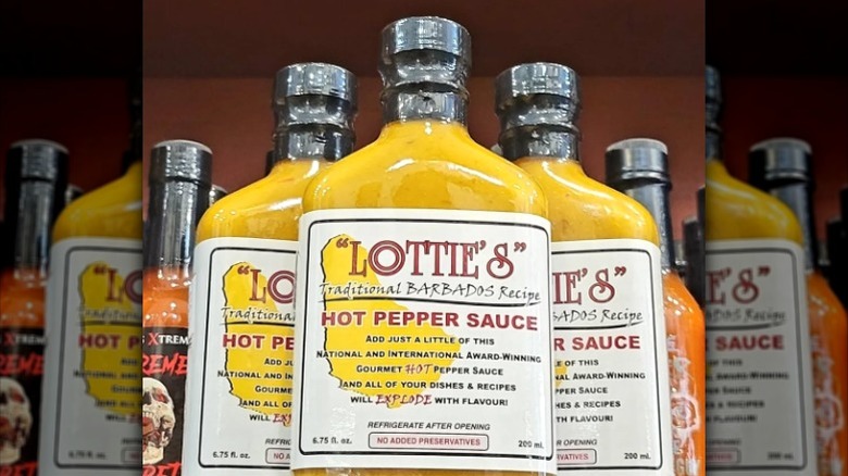 Bottles of Lottie's hot sauce on a shelf.