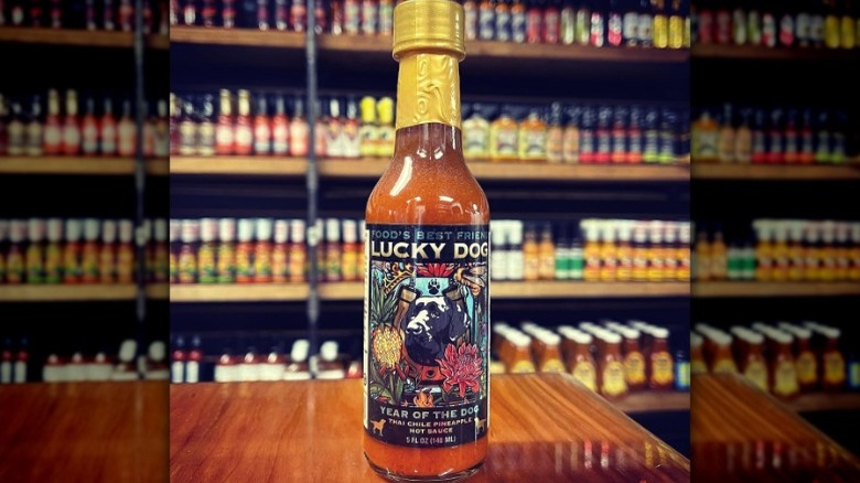 A bottle of Lucky Dog Year Of The Dog Chile Pineapple Sauce.