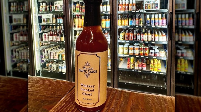A bottle of Marshall's Haute Sauce Whiskey Smoked Ghost Hot Sauce.