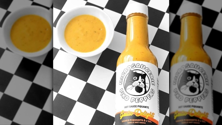 A bottle of Piko Peppers Garlic Delight Hot Sauce.