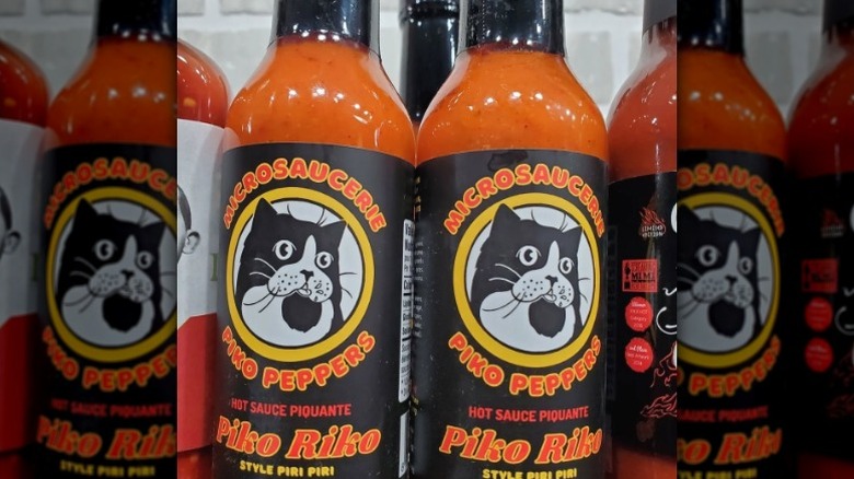 Bottles of Piko Peppers Piko Riko Hot Sauce.