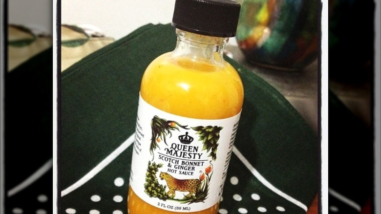 A bottle of Queen Majesty Scotch Bonnet and Ginger Hot Sauce.