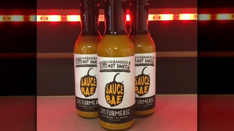 Three bottles of Sauce Bae Skinny Habanero Hot Sauce.