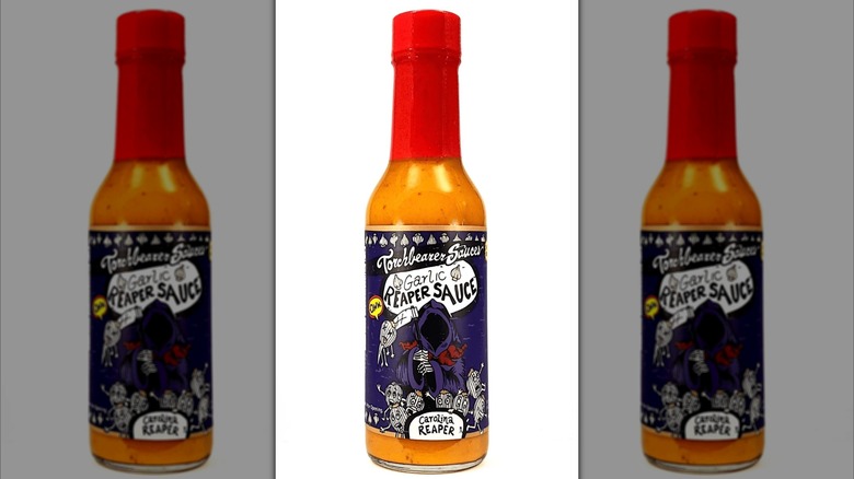 A bottle of Torchbearer Garlic Reaper Hot Sauce.