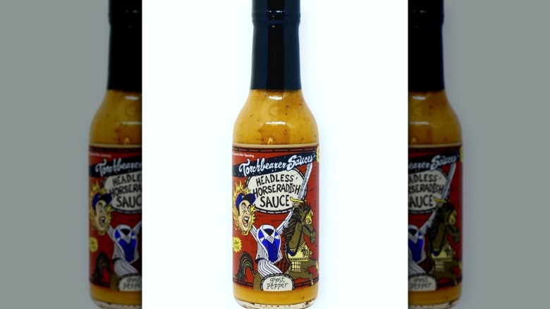 A bottle of Torchbearer Headless Horseradish Hot Sauce.