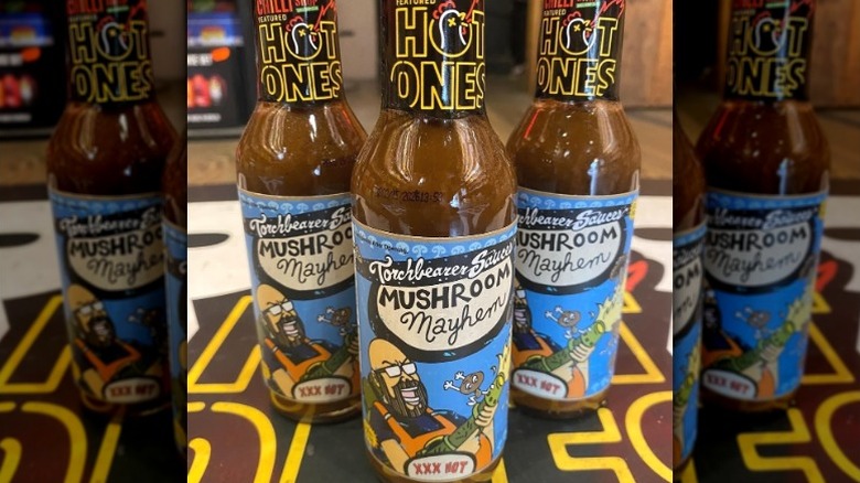 Several bottles of Torchbearer Mushroom Mayhem Hot Sauce.