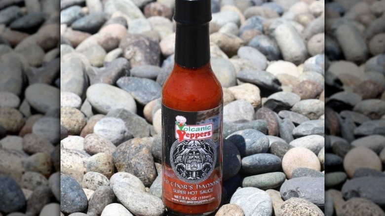A bottle of Volcanic Peppers Thor's Hammer Super Hot Sauce.