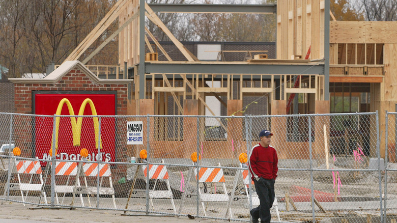 McDonald's location under construction as man walks by