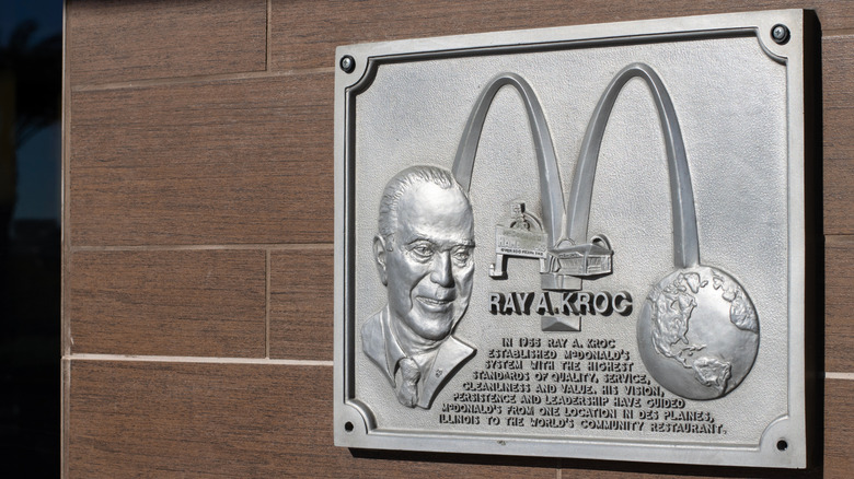 McDonald's plaque dedicated to Ray A. Kroc on outside wall of restaurant
