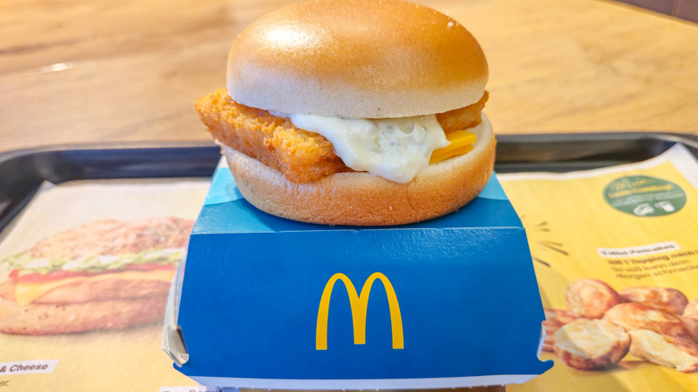 Filet-O-Fish atop box on tray in McDonald's restaurant