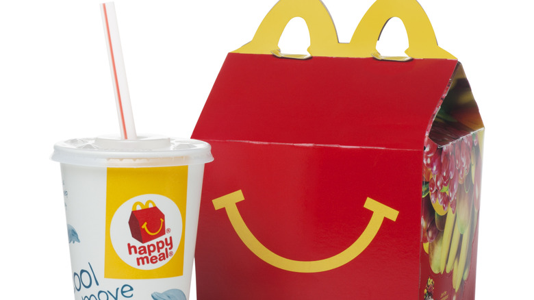 Happy Meal box with drink against white background