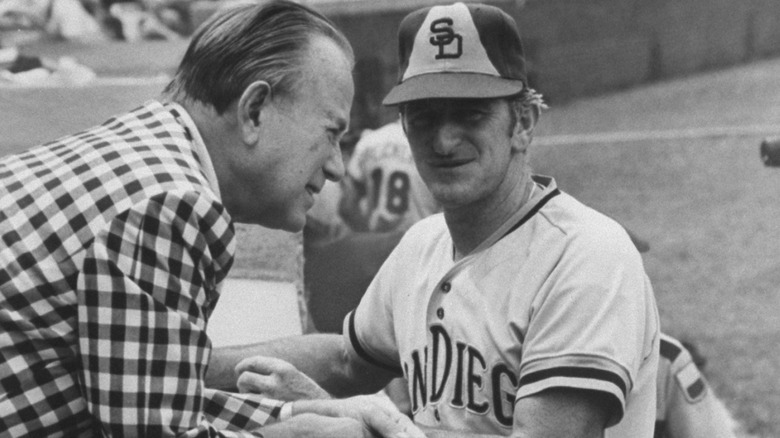 Ray Kroc talking to Padres manager John McNamara in black and white photograph