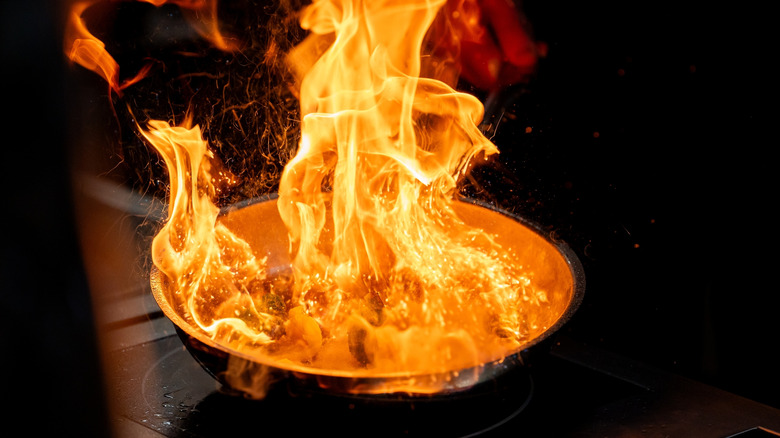 flames coming out of a pan