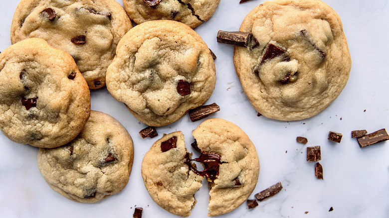Several mini chocolate chip cookies next to each other
