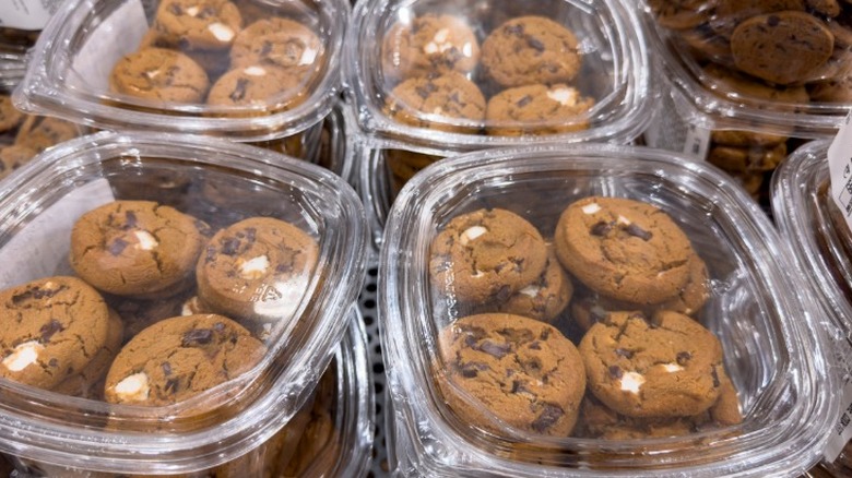 Costco cookies stacked in plastic containers at the bakery.