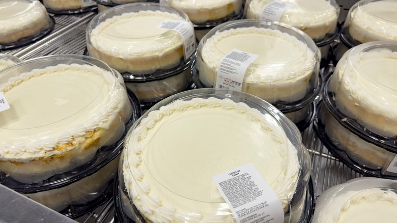 Costco cheesecakes in plastic tins on display