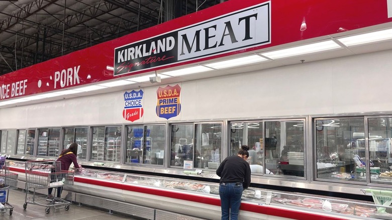 Customers shopping in Costco's meat department