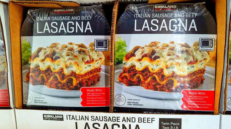 Two packages of Kirkland Signature Italian sausage and beef lasagna on display at Costco