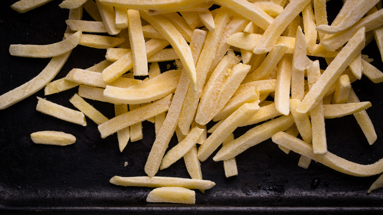Frozen french fries on tray