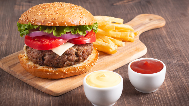 Homemade burger on wooden board