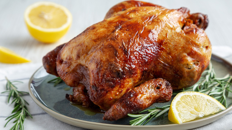 generic rotisserie chicken on a blue plate