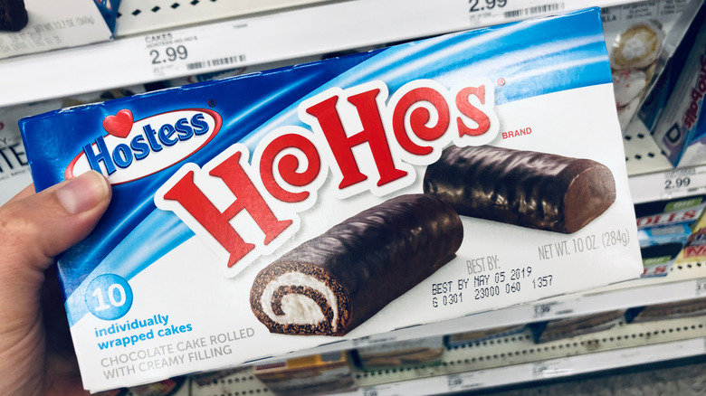 Hand holding box of Hostess Ho Hos