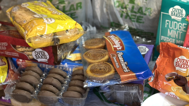 Assorted Dollar Tree sweets and packages stacked on top of each other