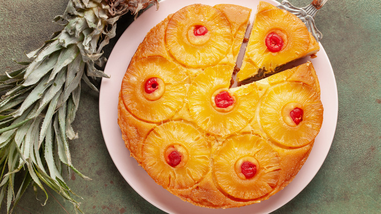 Homemade pineapple upside down pie with candied cherries.