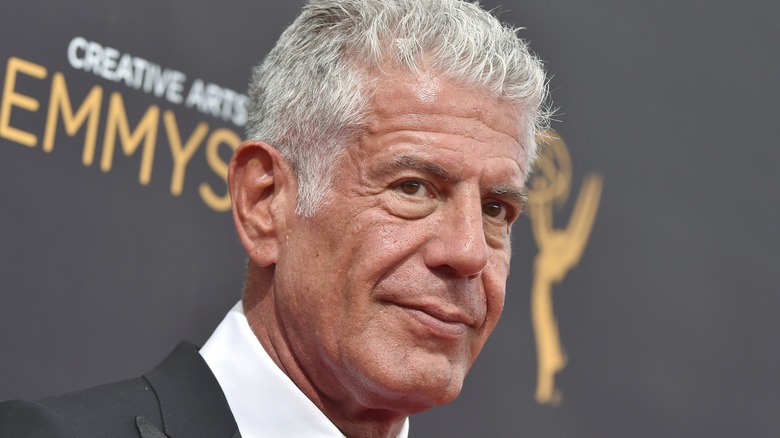 Anthony Bourdain posing for photograph