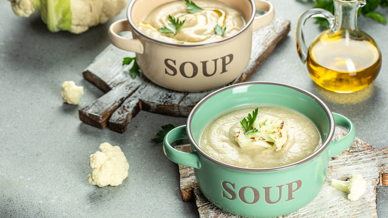 Two crocks of vichyssoise soup, with the word "soup" on the front