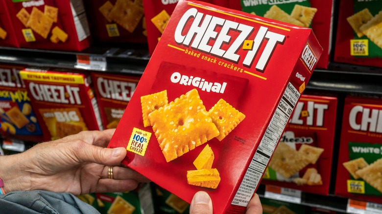 Hands holding a box of Cheez-Its