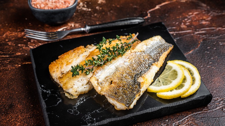Pan-fried seabass with rosemary and lemon slices