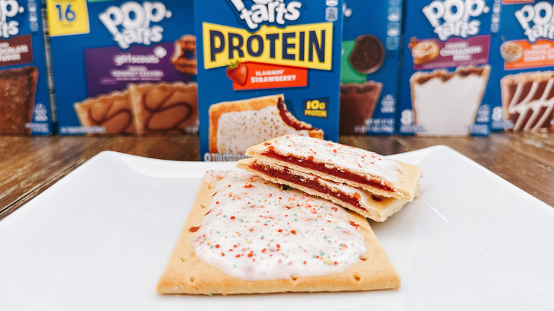 A cross section of a protein Pop-Tart with a whole Pop-Tart on a plate.