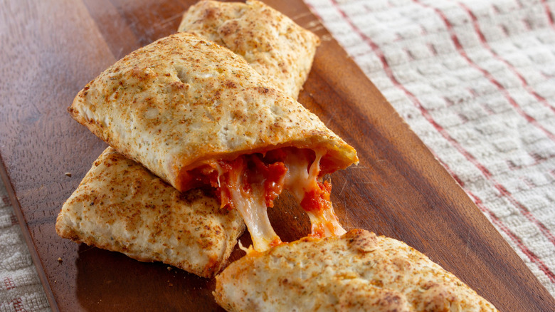 A view of a sliced microwavable pizza pocket